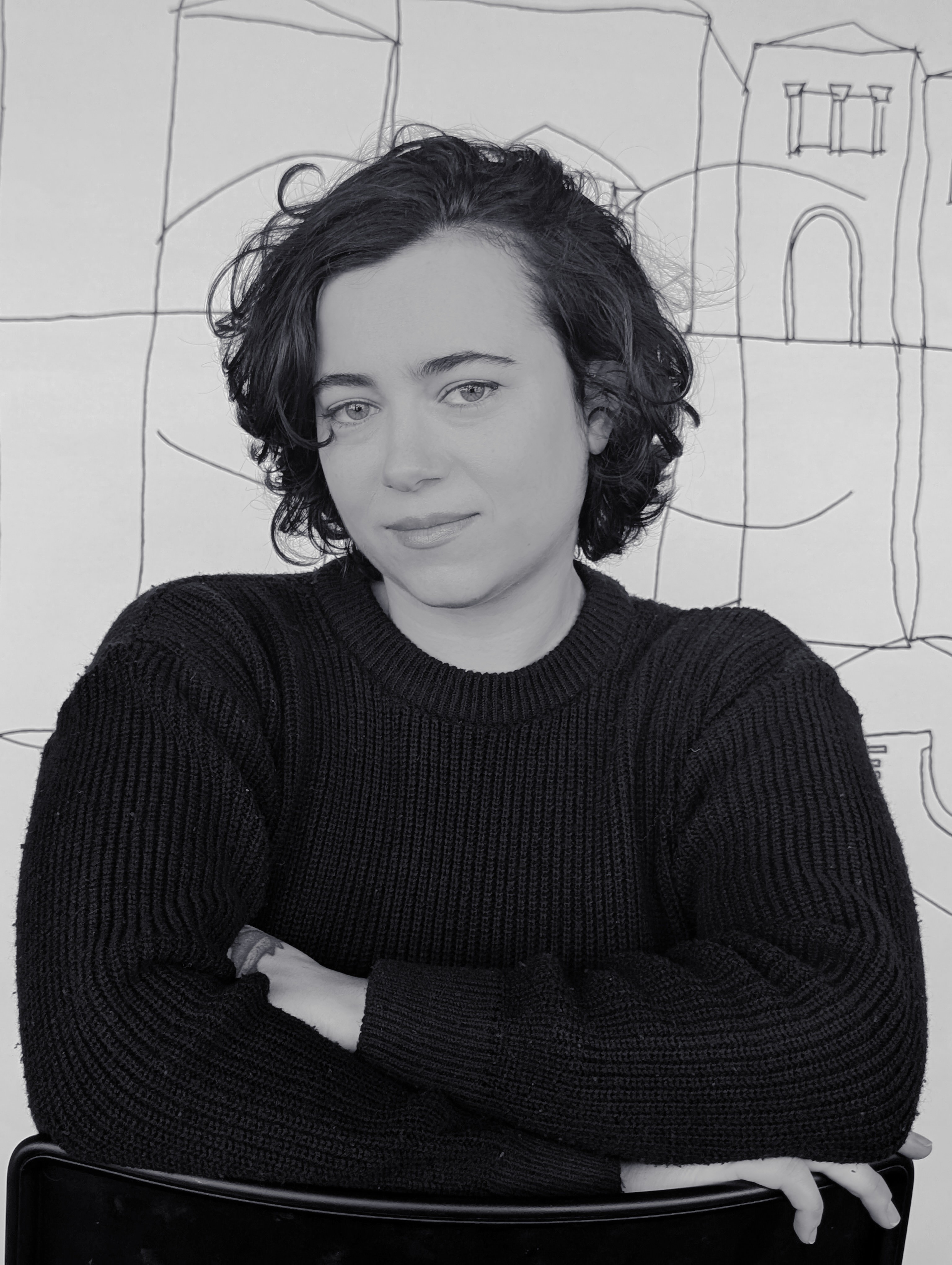 Brazilian cutie pie with short hair wearing black sweater 